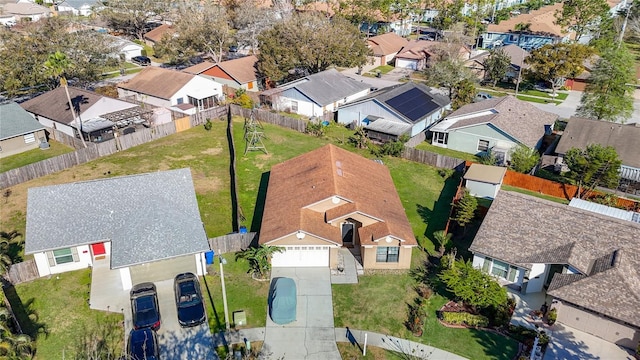 birds eye view of property with a residential view