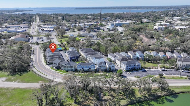 drone / aerial view featuring a water view and a residential view