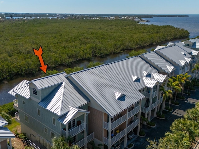 birds eye view of property with a water view