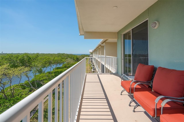 balcony featuring a water view