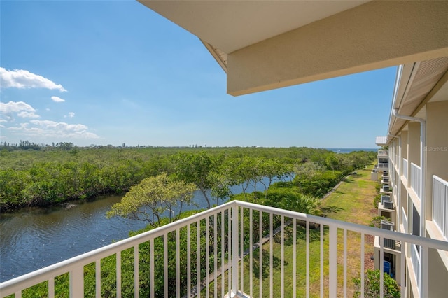 balcony featuring a water view