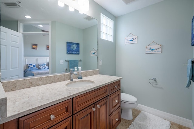 bathroom featuring ensuite bathroom, toilet, vanity, visible vents, and baseboards