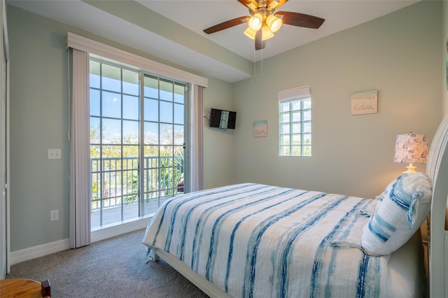 carpeted bedroom featuring access to outside, ceiling fan, and baseboards