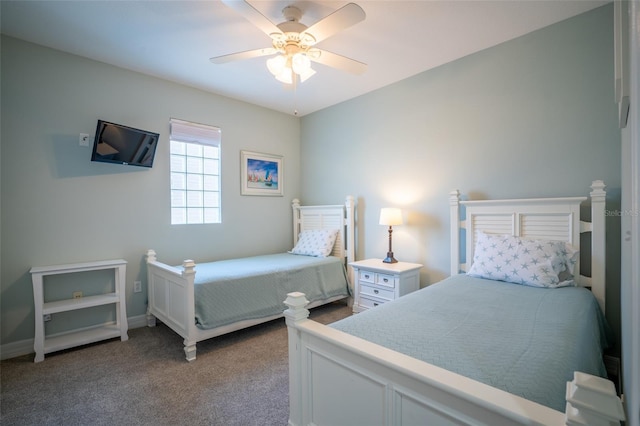 bedroom featuring carpet floors, baseboards, and a ceiling fan