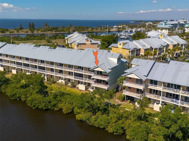 aerial view featuring a residential view and a water view