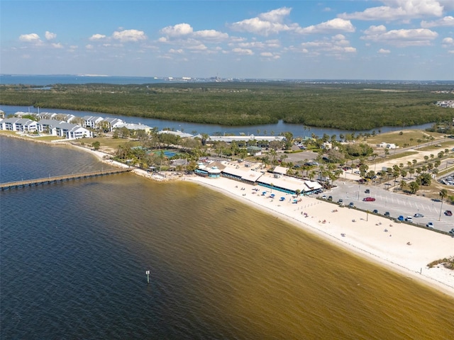 birds eye view of property with a water view and a view of the beach