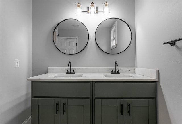 full bath with a sink and double vanity