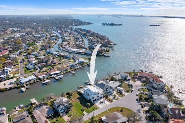 birds eye view of property with a residential view and a water view