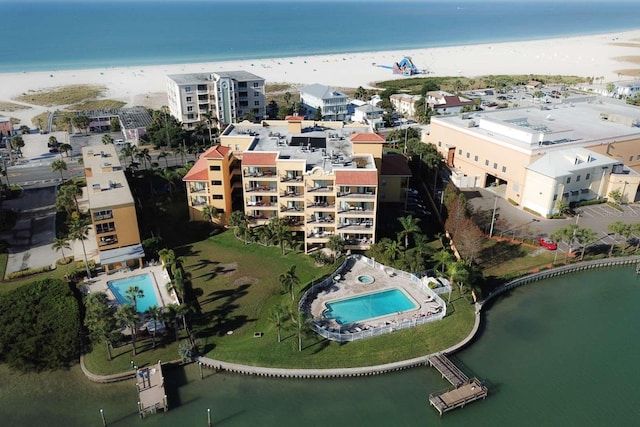 aerial view with a water view and a beach view