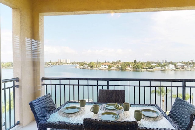 balcony featuring a water view