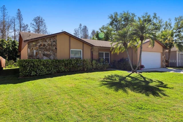 view of front of property featuring a garage, stone siding, and a front lawn