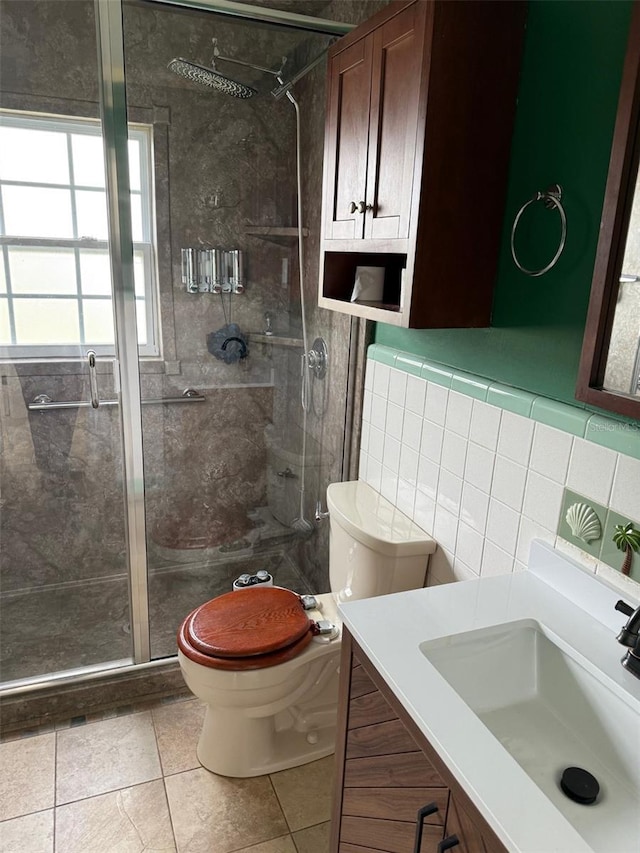 full bathroom featuring tasteful backsplash, toilet, vanity, a shower stall, and tile walls