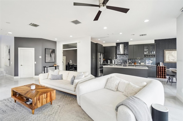 living room featuring visible vents and recessed lighting