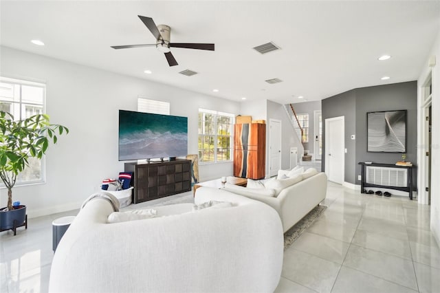 living room featuring recessed lighting, visible vents, stairway, and baseboards