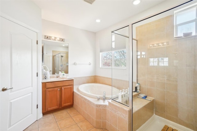 bathroom with tile patterned flooring, a garden tub, recessed lighting, vanity, and a stall shower