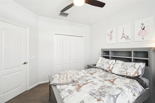 bedroom with a closet, visible vents, dark carpet, ceiling fan, and baseboards