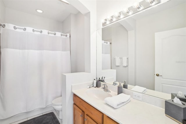 bathroom with tile patterned flooring, vanity, toilet, and shower / bath combo