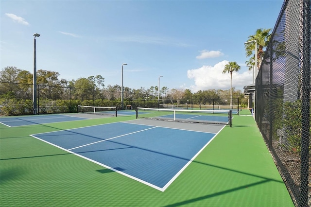 view of sport court with fence