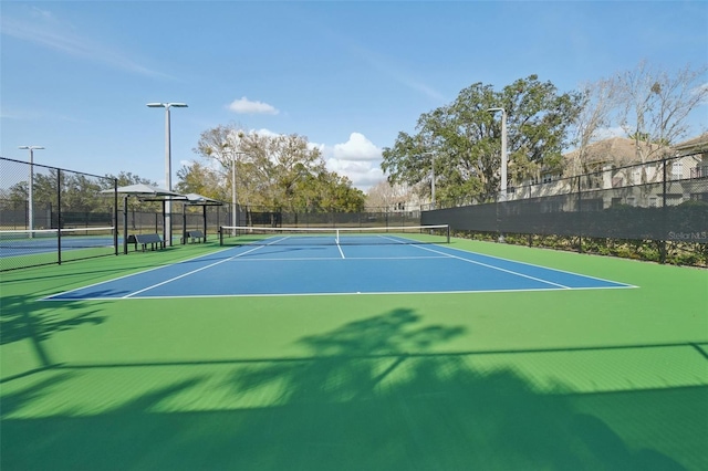 view of sport court featuring community basketball court and fence