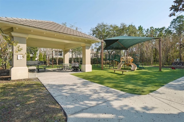 surrounding community featuring playground community, a lawn, and a gazebo