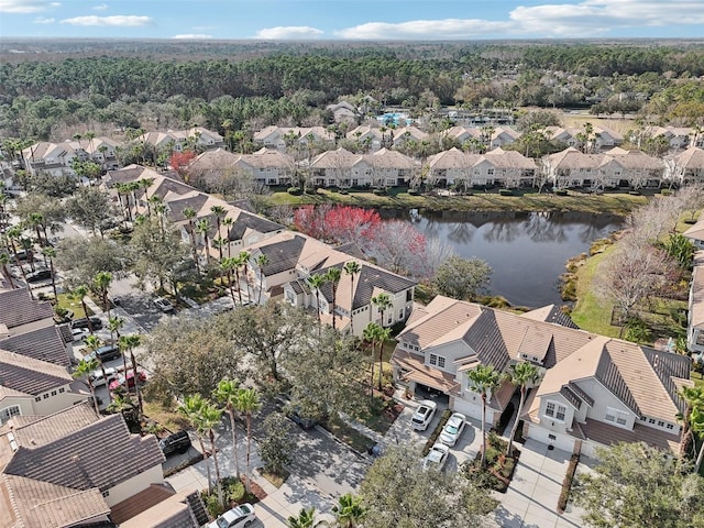 bird's eye view with a residential view and a water view