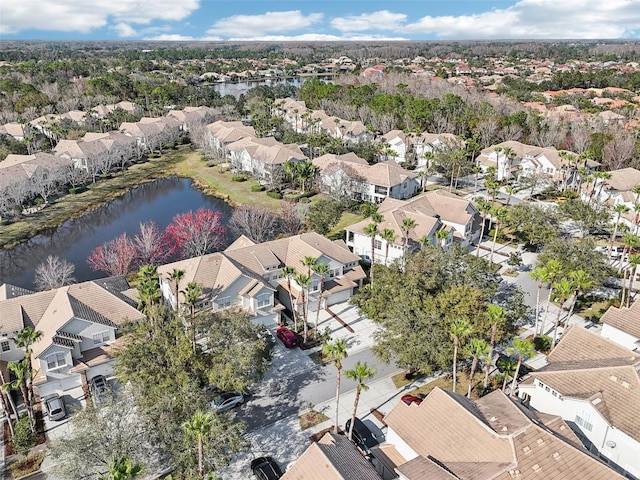 birds eye view of property with a residential view and a water view