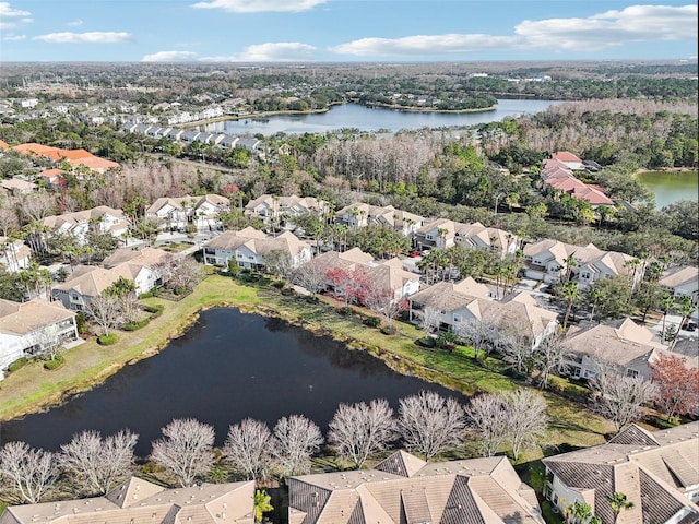 birds eye view of property featuring a water view and a residential view