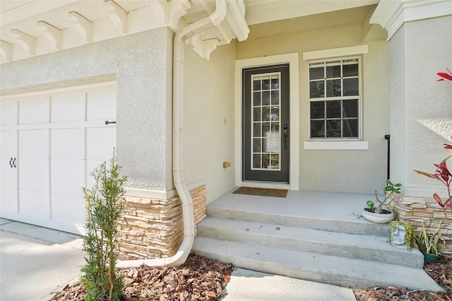 property entrance with stucco siding