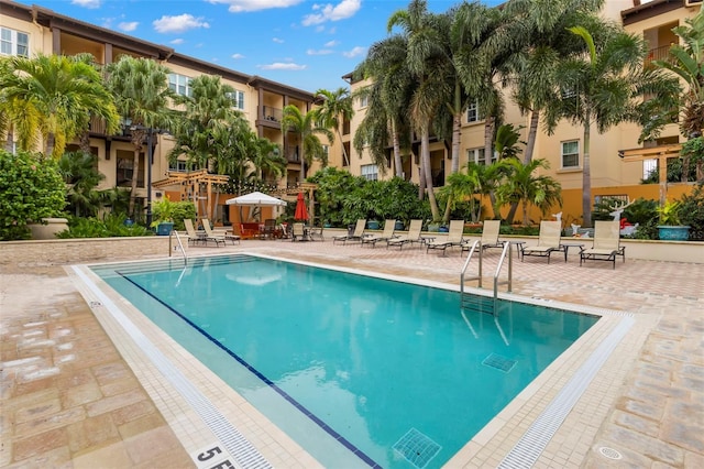 community pool featuring a patio area