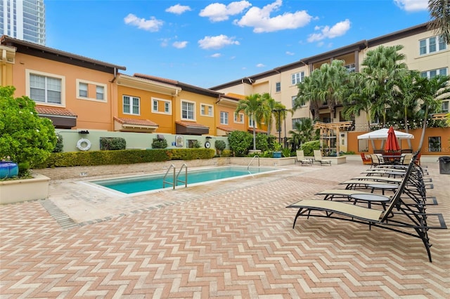 community pool with a patio area