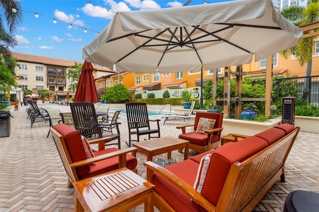 view of patio featuring fence