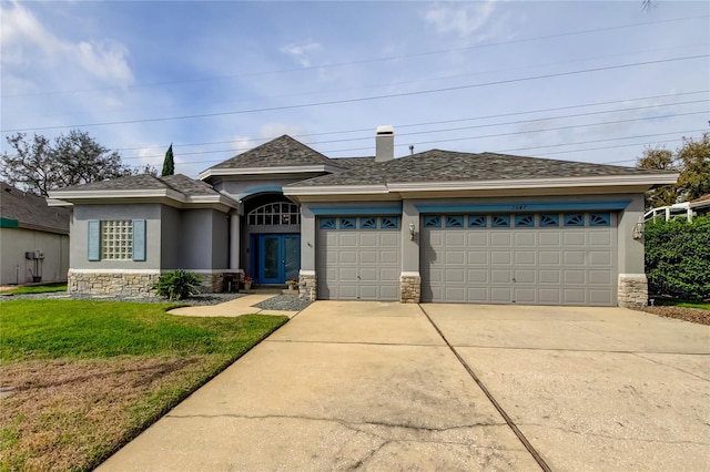 view of front facade featuring stucco siding, an attached garage, and concrete driveway