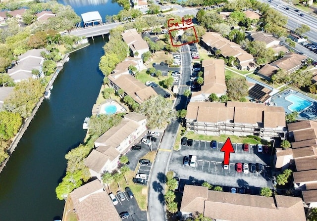 aerial view featuring a water view and a residential view