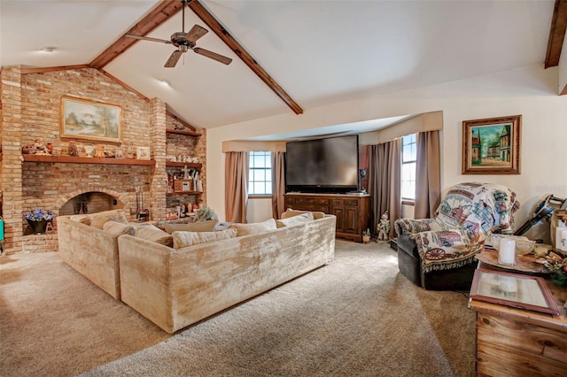 living area featuring lofted ceiling with beams, a fireplace, a ceiling fan, and light colored carpet