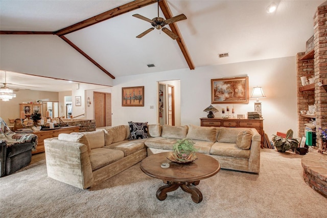 living area with visible vents, carpet flooring, a brick fireplace, high vaulted ceiling, and beam ceiling