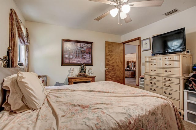 bedroom with ceiling fan, carpet flooring, and visible vents