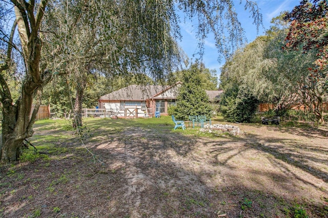 view of yard featuring fence