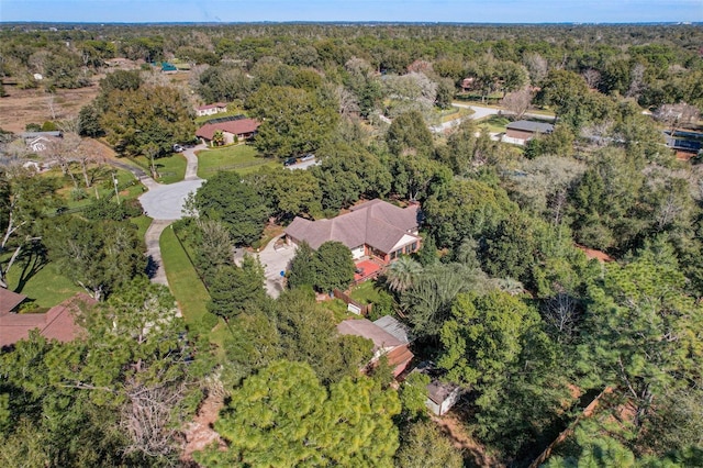 bird's eye view featuring a wooded view