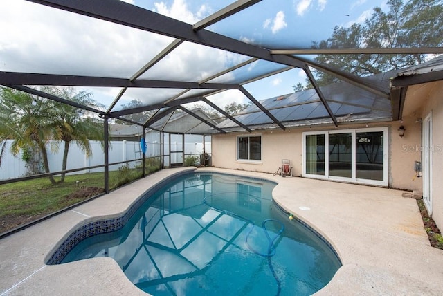 view of pool featuring a fenced in pool, glass enclosure, a fenced backyard, a water view, and a patio area