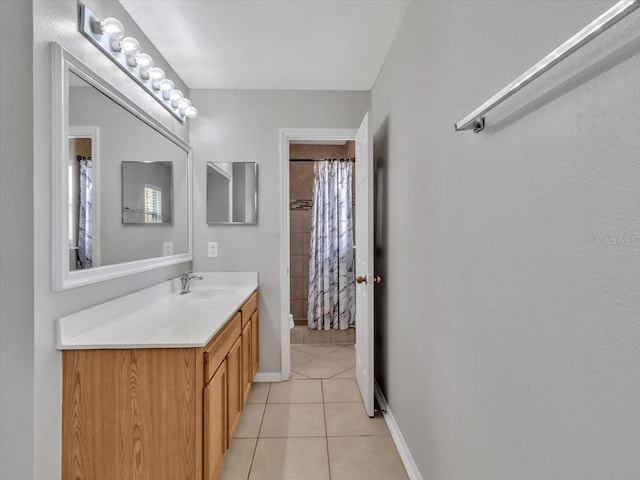 full bathroom featuring baseboards, a shower with shower curtain, toilet, tile patterned floors, and vanity