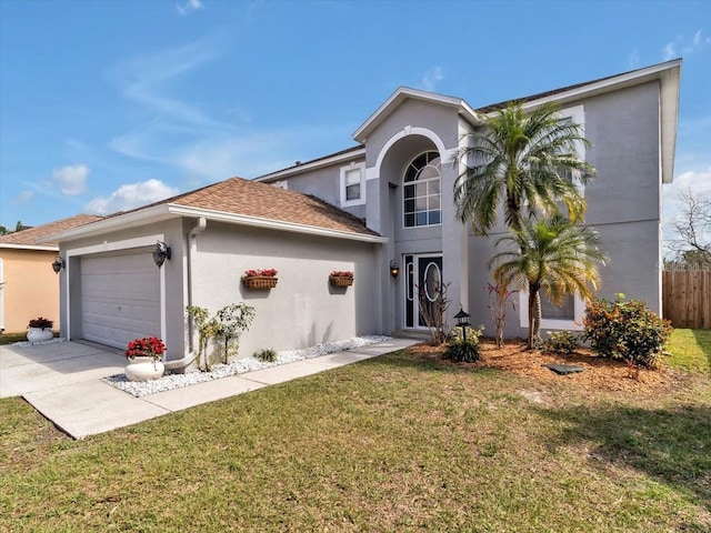 traditional-style home with stucco siding, a garage, and concrete driveway