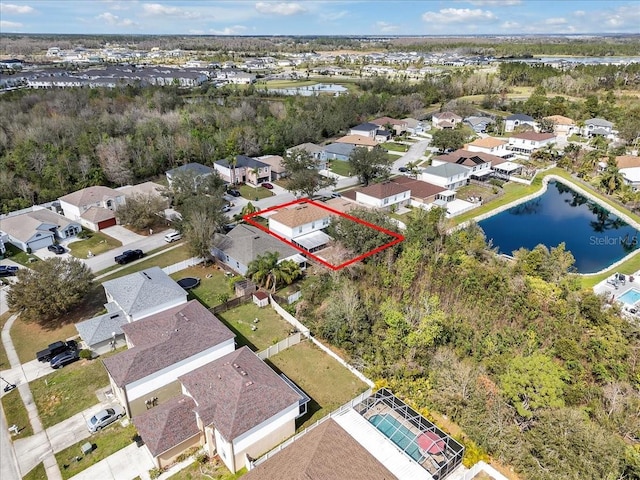 aerial view of residential area featuring property parcel outlined and a nearby body of water