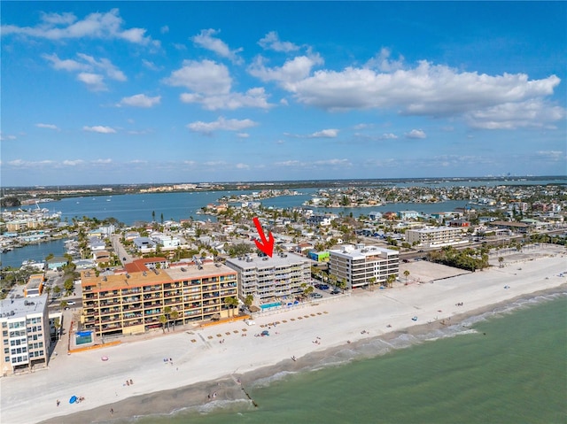 aerial view with a city view, a beach view, and a water view