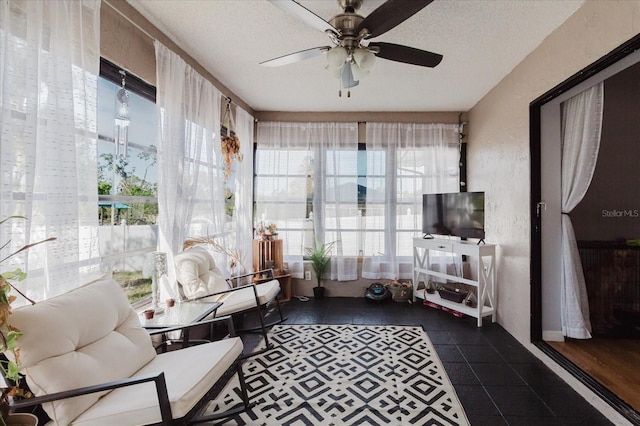 sunroom with ceiling fan