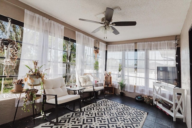 sunroom / solarium with ceiling fan