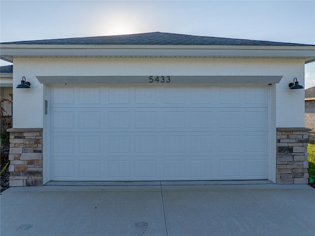 garage featuring driveway