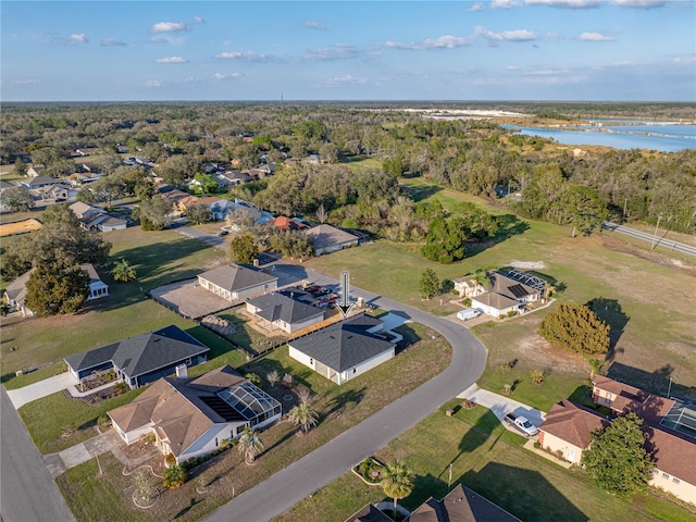 drone / aerial view featuring a residential view and a water view