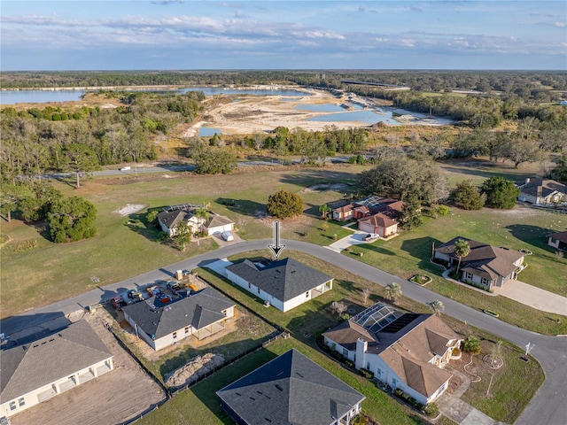 birds eye view of property with a residential view and a water view