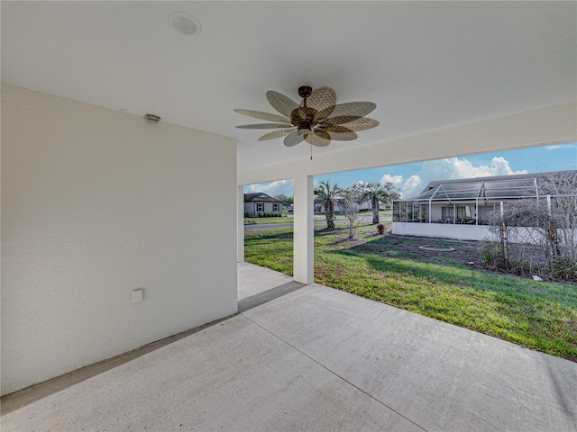 view of patio / terrace featuring a lanai and a ceiling fan