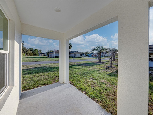 view of yard with a patio area and a residential view